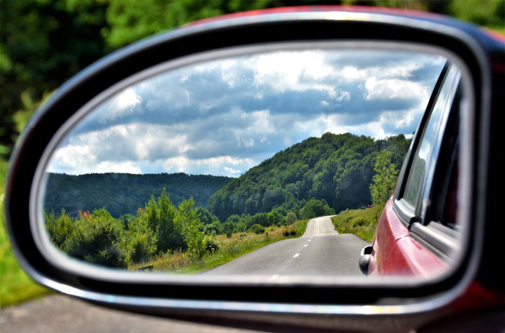 Beautiful landscape seen through the rearview mirror