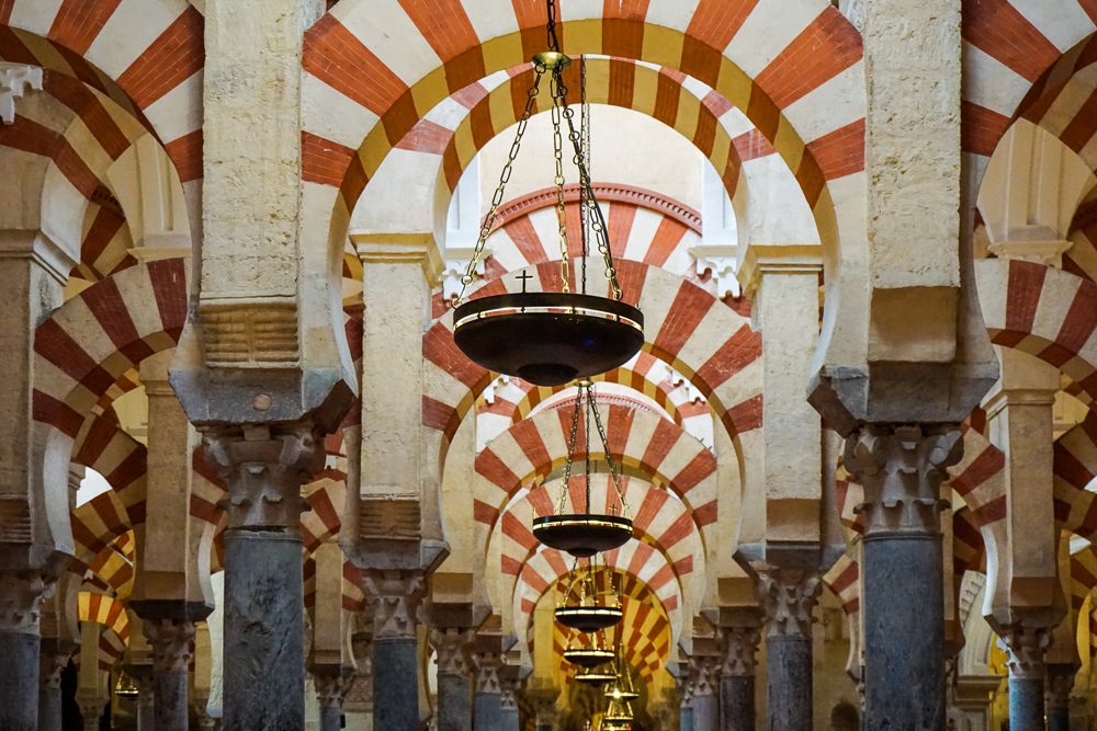 Close up of the red and white arches in the Mosque-Cathedral in Cordoba Spain